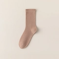 Single khaki cotton mid-calf sock with knitted texture on beige background - Light Coffee