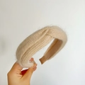 Close-up of soft beige plush knitted headband with classic knotted design texture - Cross Knot / Milk Tea