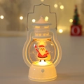 Close-up of white Christmas LED lantern with Santa figure and warm bokeh lighting - Christmas Lantern (Backpack Santa)