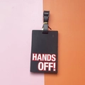 Black PVC luggage tag with 3D embossed HANDS OFF text and adjustable strap - HANDS OFF Slogan / Black
