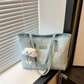 Light blue embroidered tote bag with wavy patterns and cute white cloud pendant - Blue