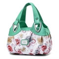 Fashionable floral tote bag with mint green handles and polished silver hardware - Green-Rose Floral
