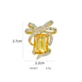 Golden bow brooch with a large yellow gem and white zircons, size 2.7cm by 2.2cm - B795 Golden/Elegant Bow
