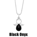 Macro detail of angel wing pendant featuring a black onyx gemstone on a ball chain - Black Agate
