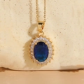 14K gold plated necklace with oval deep blue resin stone and small zircon accents - Sapphire Blue