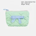Quilted mint green PU makeup bag with blue checkered bow accent and zipper detail - Green Hexagon Bag