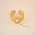 Detail view of gold boho ring with white stone inlay, sunburst motif and 13mm diameter - White Jade