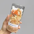 Handheld view of a dried flower glass bottle with cork stopper and orange bouquet detail - Orange Wishing Bottle / 6.5*12.5cm