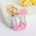 Pink glitter resin letter U keychain with gold star sequins and matching tassel charm - Letter U / Pink