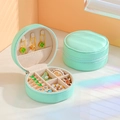 Portable mint green PU leather round jewelry travel case with secure zipper closure - Lotus Green