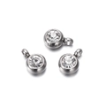 Detailed macro view of three silver stainless steel round pendants with clear zircon stones - 10 Pieces per Pack / Steel Border White Stone