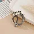 Macro shot of silver dragon brooch featuring detailed scales and a small pearl accent - Antique Silver Dragon Style 6