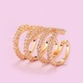 Close-up of a multi-layer gold ear cuff with shimmering micro-pave cubic zirconia - Four Layer Pave Style(A2301) / KC Gold