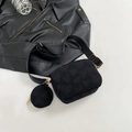 Black crossbody bag with heart texture, wide strap, and small round coin purse accessory - Black