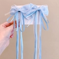 Detailed view of blue ribbon and white organza bow hairpins with long streamers - One Pair / Blue