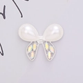 Macro detail of alloy butterfly accessory with white pearls and sparkling rhinestones - D1378 Pearl Bowknot Silver