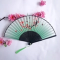 Traditional bamboo folding fan featuring green gradient fabric with red plum blossoms - Green & White Gradient Red Plum Blossom Butterfly Style (Women's Fan-49)