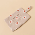 Detail view of cotton muslin baby wipe pouch featuring daisy prints and clear PVC window - White Daisy