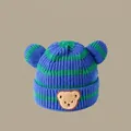 Winter knit baby hat featuring blue and green stripes with a cute brown bear patch - Striped Bear Blue (2 Months - 2 Years)