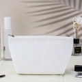 Large capacity white corduroy travel makeup bag with zip closure on natural background - Dumpling Bag / White