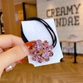 Élastique à cheveux avec fleur en cristal rose sur monture métallique dorée élégante - Violet