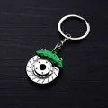 Car key ring featuring a silver metal brake disc and a vibrant green brake caliper - Green Brake Disc