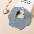 Detail of 6-layer petal-shaped baby bib in grey-blue gauze with secure snap closure - Lake Blue