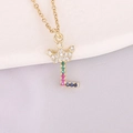 Macro shot of 18K gold letter L pendant with crown and multicolored zircon stones - Letter L Style
