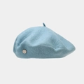 Detail of light blue wool beret featuring a classic silver metal side logo and soft texture - One Size / Light Blue