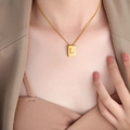 Minimalist gold square pendant necklace featuring letter L on stylish rectangular charm - Letter L Style (P1506-L)