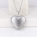 Polished silver stainless steel heart locket necklace with floral scroll engravings - Wave Pattern Heart/Steel