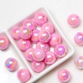 Macro detail of pink acrylic rainbow beads with pearlescent finish for DIY jewelry - Deep Pink