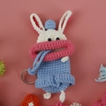 Handmade crochet bunny key case with pink sausage mouth and blue ears in light blue and white - Blue Rabbit