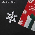 Macro detail of silver snowflake charms with purple glitter for Christmas DIY crafts - Medium Silver