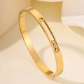 Minimalist gold titanium steel cuff bracelet with three sliding cubic zirconia stones - Gold