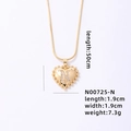 Golden heart necklace with N initial diamond pendant and sizing measurement details - Letter N