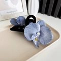 Blue-purple orchid hair claw clip with white pearl detail on a ceramic tray - Claw Clip Gray Blue