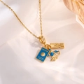 Gold travel necklace with blue enamel passport, plane, and boarding pass charms - Gold Airplane Travel Passport Style