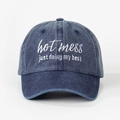 Detailed close-up of hot mess embroidery on washed navy blue cotton baseball cap - Adjustable / Navy Blue