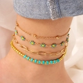 Set of four gold-finish daisy anklets with sky blue and yellow enamel charms - Blue - Anklet