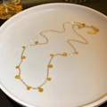 Minimalist 18K gold plated choker necklace with small round sequins on a ceramic tray - Round Fringe Necklace (8811) / Gold