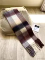 Thick plaid scarf in coffee beige with chunky tassels on a cozy sofa setting - AC Coffee Beige Plaid