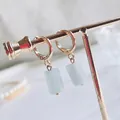 Golden leverback earrings with rectangular light blue natural stone crystal pendants - Aquamarine