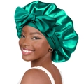 Stretch satin emerald green sleep cap featuring a large decorative bow tie design - One Size / Dark Green