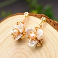 Ethnic style flower earrings with pink and natural white pearls on wood surface - Three-Petal Flower Studs