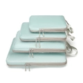 Detail of four light mint green waterproof travel organizers with textured fabric - Four-Piece Set / Blue