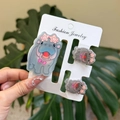 Close-up of three cute gray acrylic hippo hair clips with pink star details and bows - Star Glasses Pink Bow Hippo Clip 3PCS Set