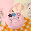 Detailed view of pink plush unicorn crossbody bag with golden horn and floral decor - Pink