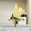 Close-up of golden mirror acrylic Christmas tree cake topper with Merry Christmas text - Gold Mirror Christmas Tree