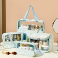 Blue daisy print 4-piece toiletry bag set with transparent PVC panels and handle - 4-Piece Daisy Set / Blue Floral Print